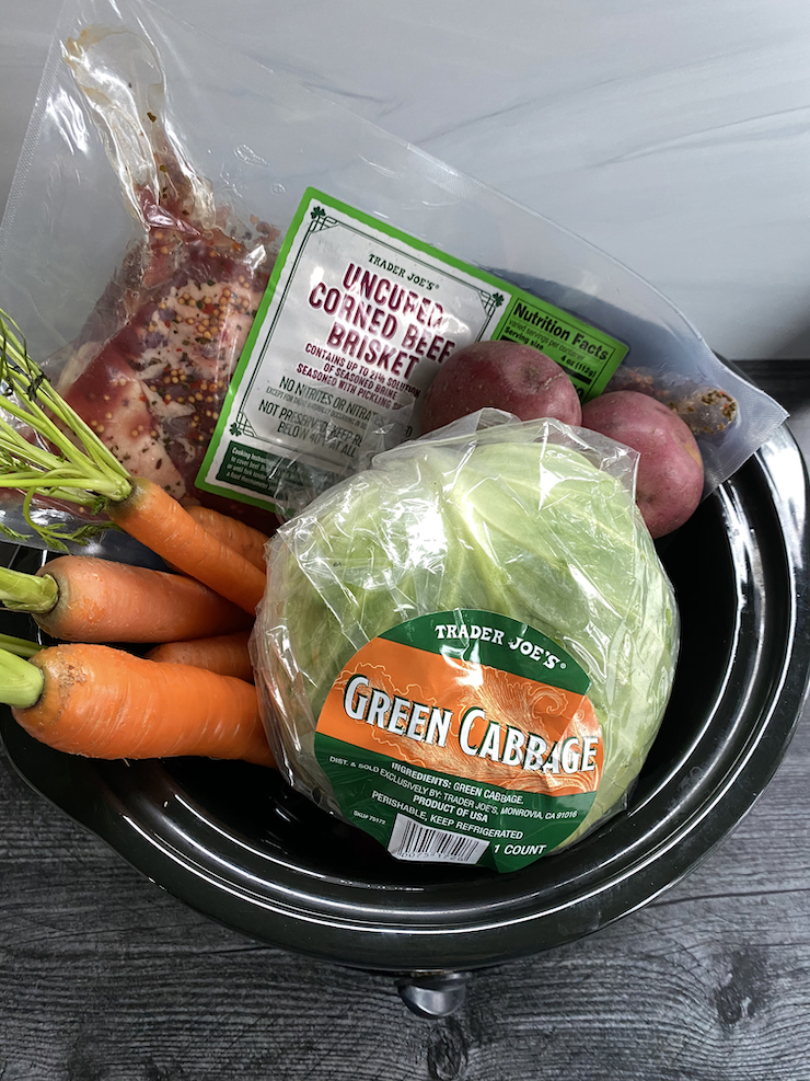 Trader Joe's Corned Beef and Cabbage arranged in a crockpot.