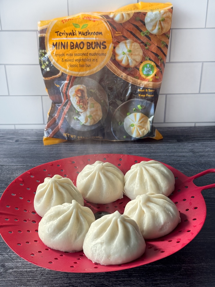 Trader Joe's Teriyaki Mushroom Mini Bao Buns bag with bao on a red steamer basket