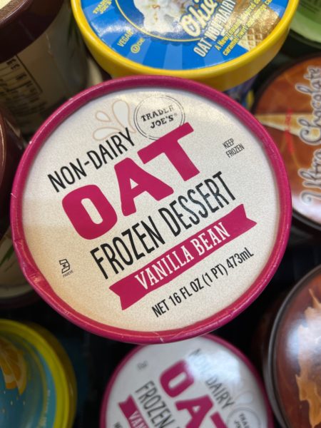 Trader Joe's Non-Diary Oat Frozen Dessert in Vanilla Bean flavor shown in the freezer section of a Trader Joe's store. 