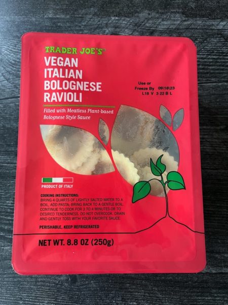 Trader Joe's Vegan Italian Bolognese package on a weathered wood background. 