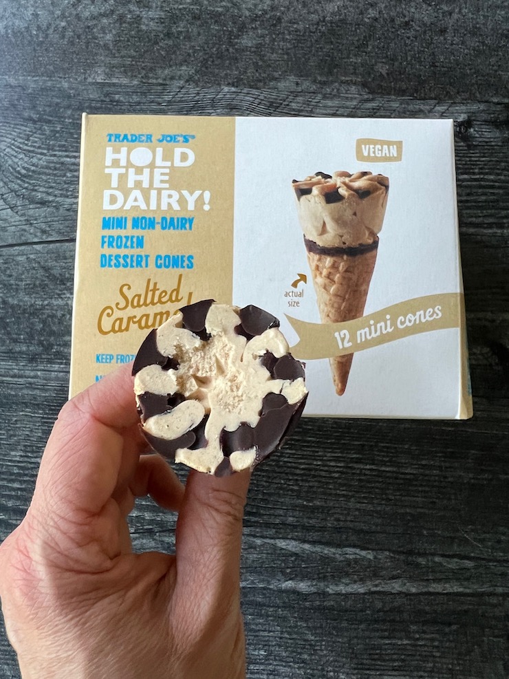 Box of Trader Joe's Hold the Dairy Mini Non-Dairy Frozen Dessert Cones in Salted Caramel flavor. On a weathered wood background. 