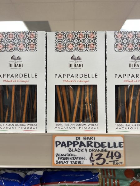 Boxes of Di Bari Pappardelle in Black and Orange on shelves at a Trader Joe's store.