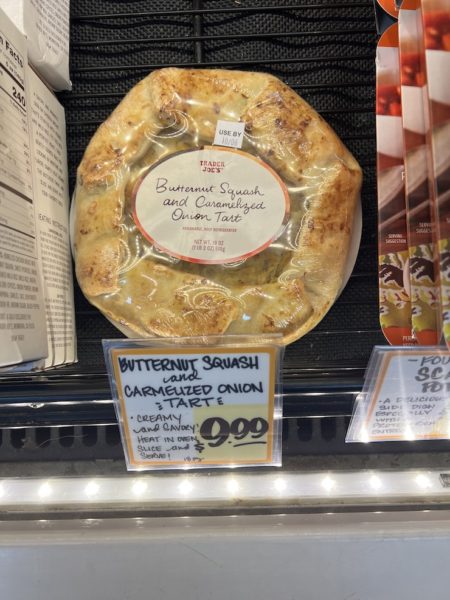 Trader Joe's Butternut squash and Caramelized Onion tart in the refrigerated section of a trader joe's.