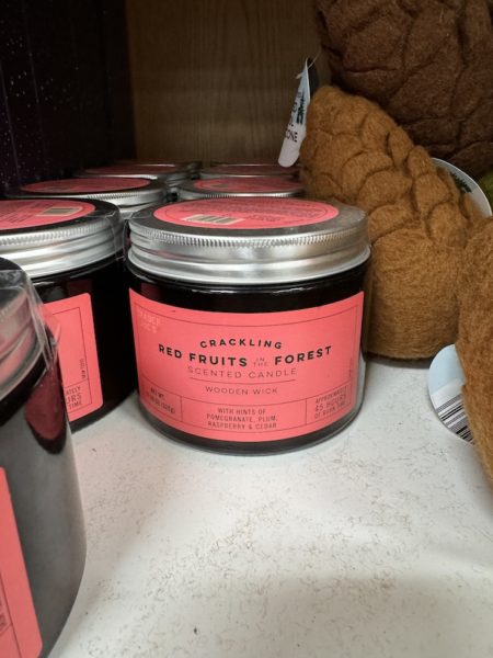 Trader Joe's Crackling Red Fruits and Forest candle on shelves in stores. 