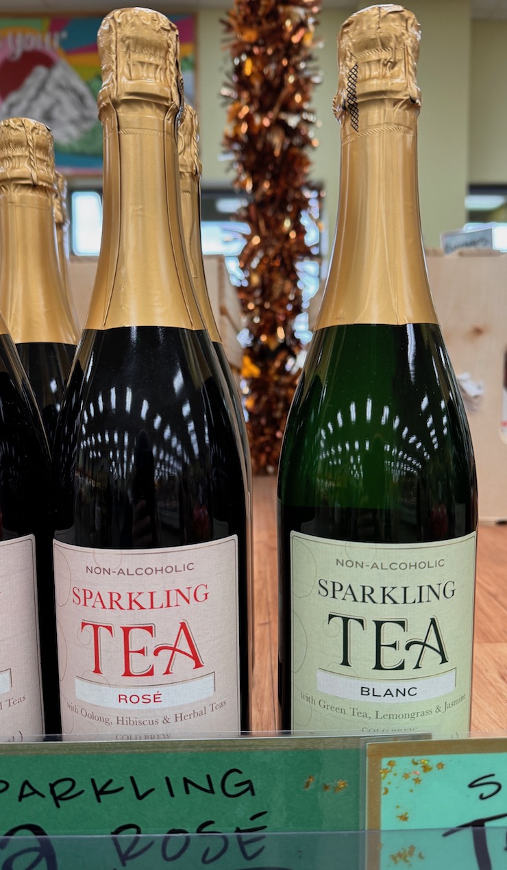 Non Alcoholic Sparkling Tea bottles on display in store.