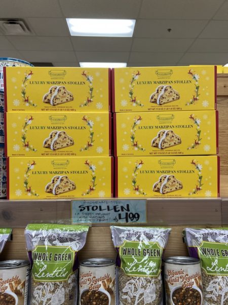 Yellow Boxes of "Luxury Marzipan Stollen" stacked on display in  aTrader Joe's store.
