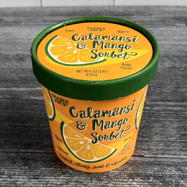 Trader Joe's Calamansi & Mango Sorbet pint container, with a green rimmed lid.