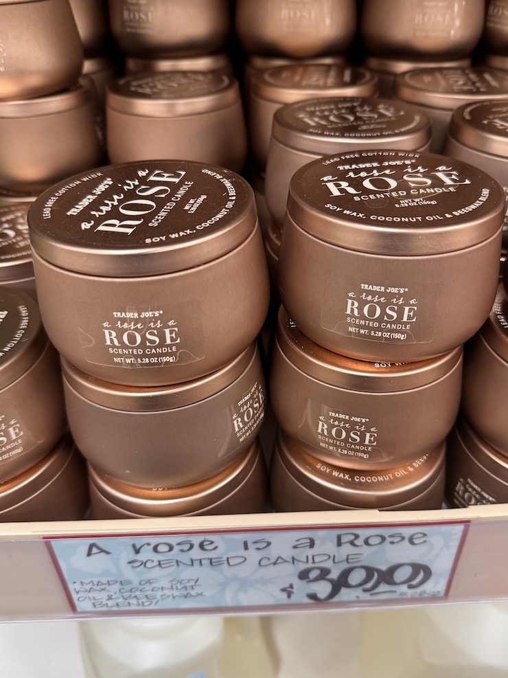 Trader Joe's A Rose is a Rose Candle in a rosegold colored tin.