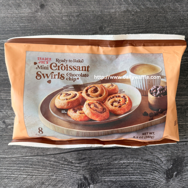 Trader Joe's Chocolate Chip Mini Croissant Swirls package on a weathered wood background.