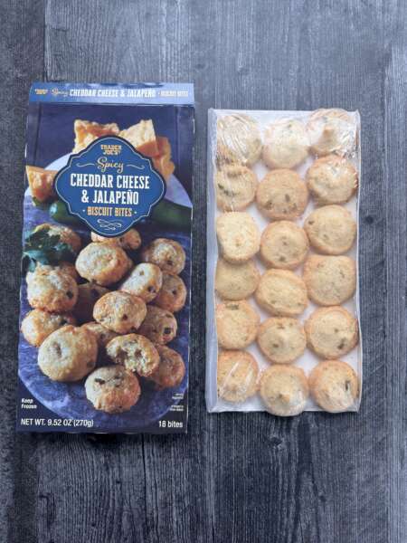 Trader Joe's Spicy Cheddar & Jalapeno Biscuit bites box next to the packaged biscuit bites.