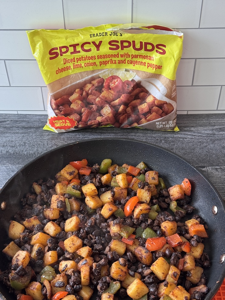Trader Joe's Spicy Spuds with breakfast burrito filling with black beans and red and green bell pepper.