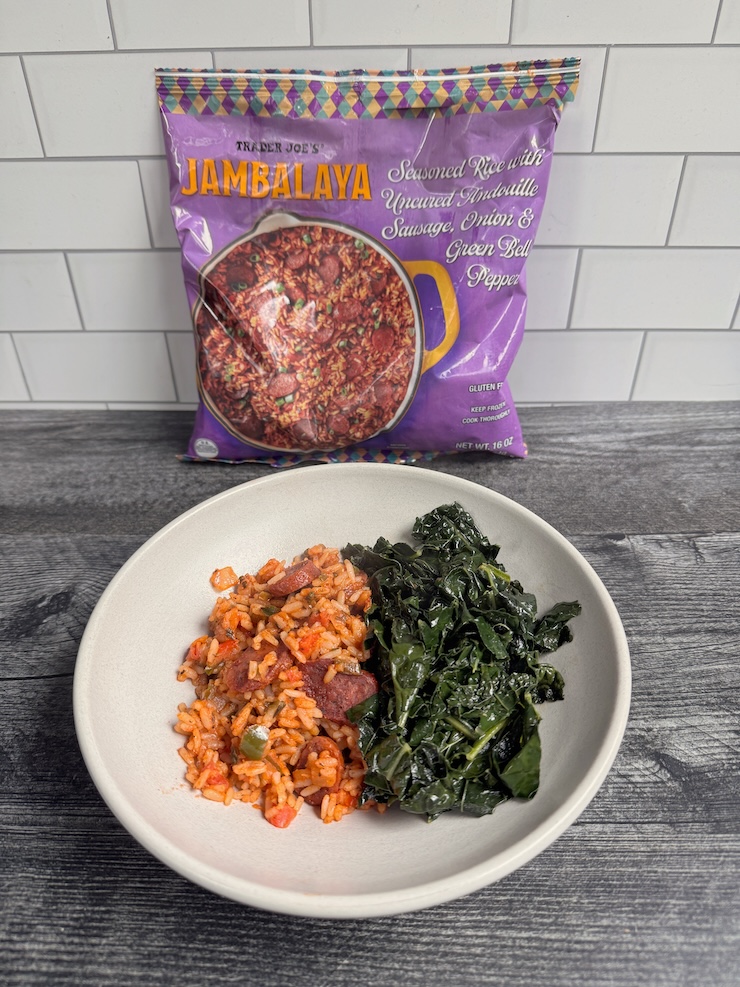 Trader Joe's Jambalaya served with sauteed kale in a white bowl