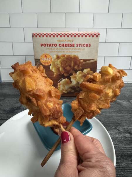 Trader Joe's Ptato Cheese Sticks crossed in front of box