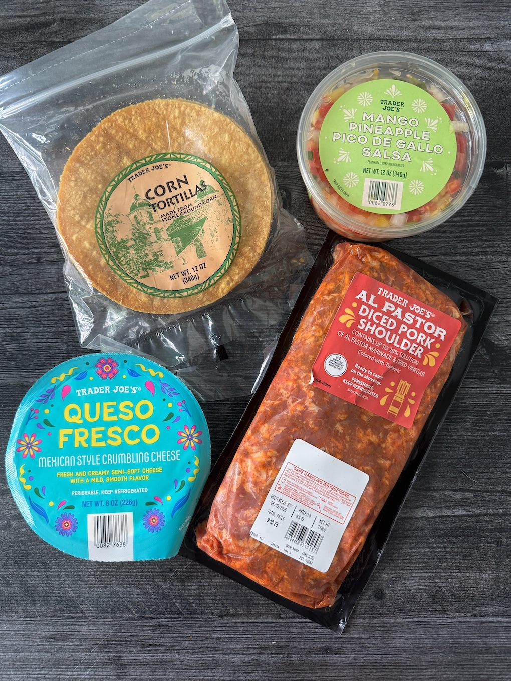Trader Joe's Items for Al Pastor Tacos: Corn Tortillas, Mango Pineapple Salsa, Al Pastor Diced Pork Shoulder, Queso Fresco