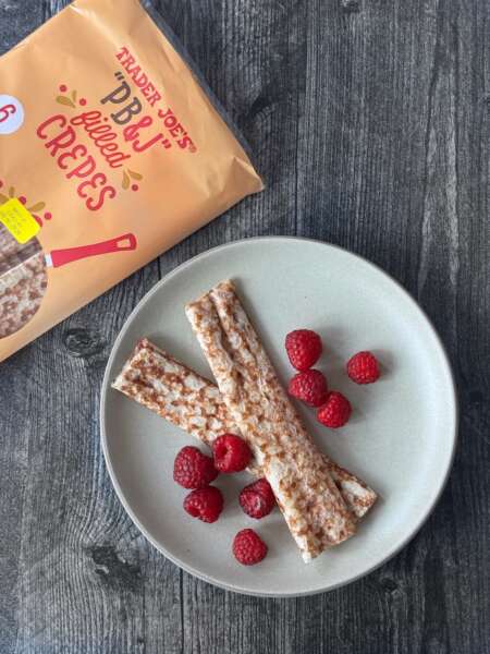 Trader Joe's PB&J Filled Crepes on a plate served with raspberries